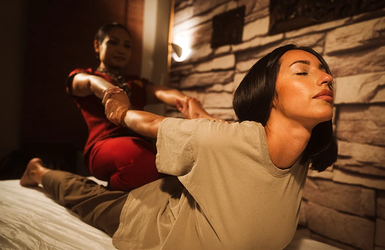 Body stretching during a Thai massage